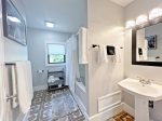 Full bathroom with shower and jetted tub combo